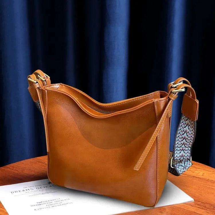 Women's genuine leather messenger bag in square vertical design with shoulder strap