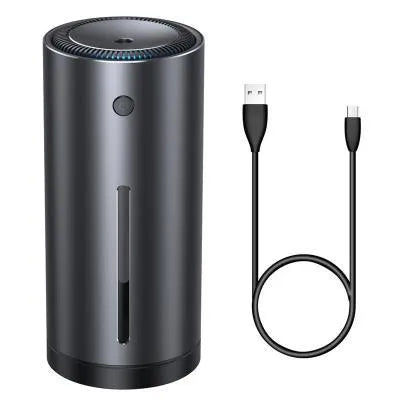 Black aluminium alloy car diffuser humidifier with USB cable on a desk.