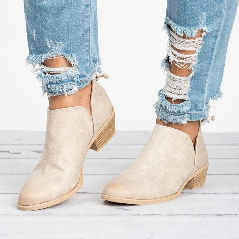 Women's butterfly-knot slip-on ankle boots in faux suede with square heel and pointed toe, available in Beige, Black, and Pink