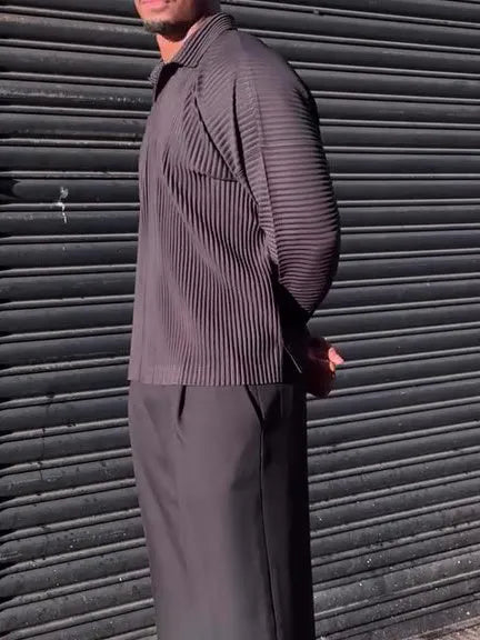 Black men's long-sleeved casual top with a pleated front detail, shown in a regular fit.