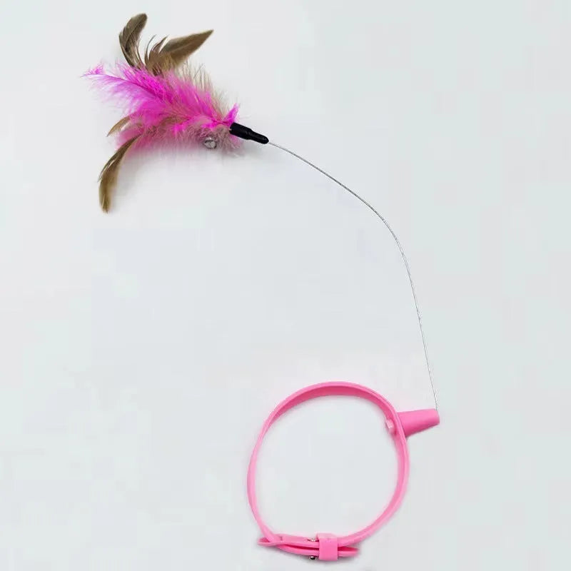 Blue adjustable cat collar with attached silicone wand, dangling feather, and a small bell for interactive play.