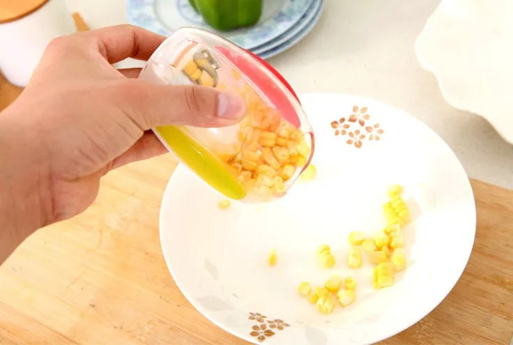 Corn stripper kitchen tool with stainless steel wavy blade and plastic handle for removing kernels from cobs