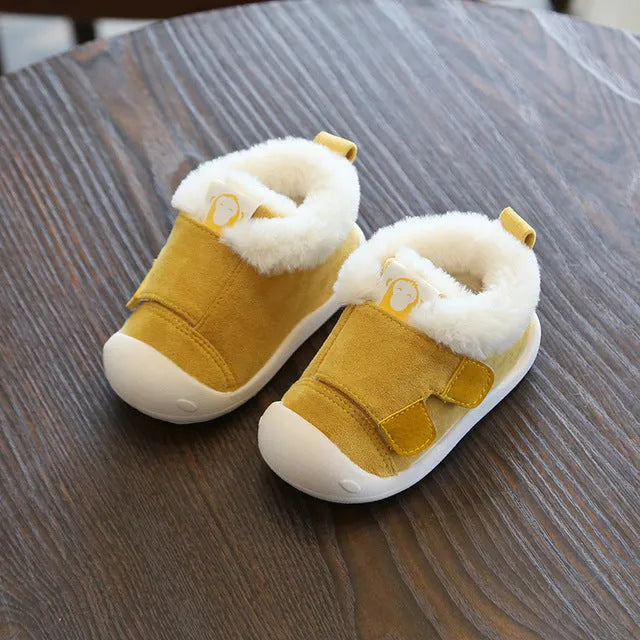 Children's velvet toddler shoes in various colours, showing non-slip sole and soft upper.