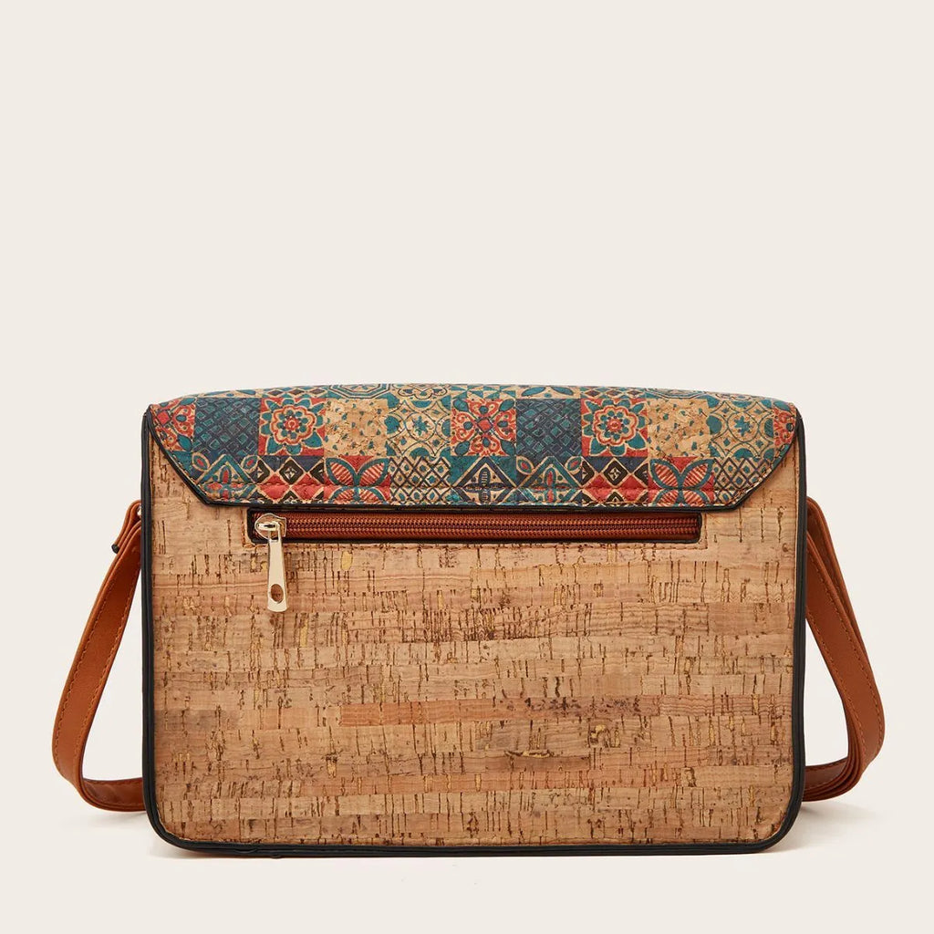Women's printed PU leather crossbody bag in a floral design, showing single shoulder strap and large compartment.