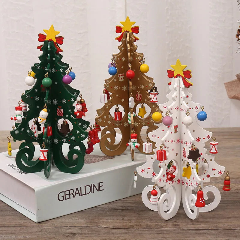 Green MDF Christmas tree ornament with laser-cut detail, 19x10.5cm, on a tree branch