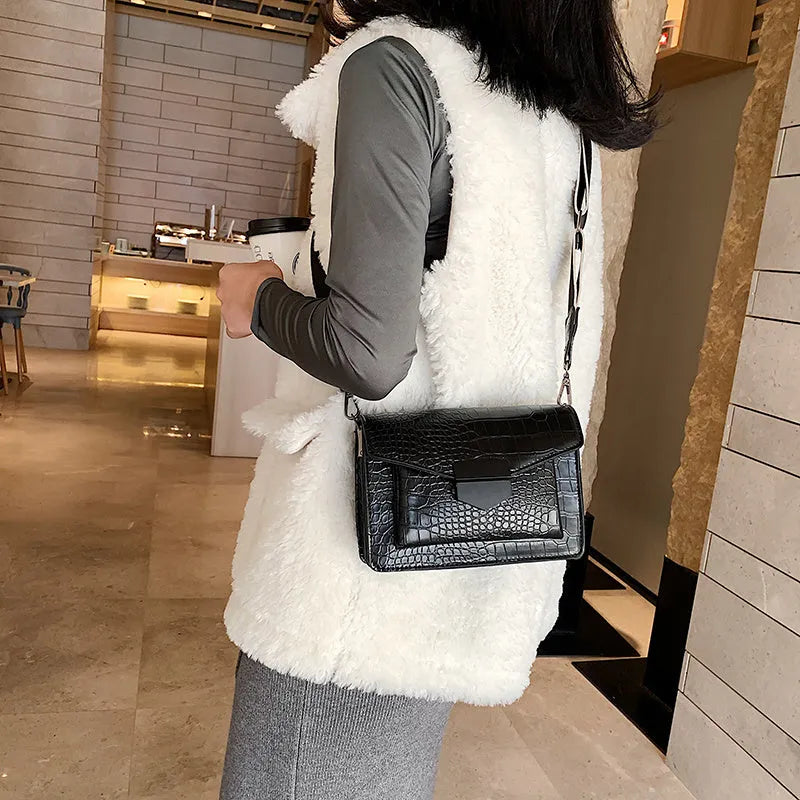 Vintage PU leather crossbody bag in black, shown with dimensions 20cm wide by 14cm high