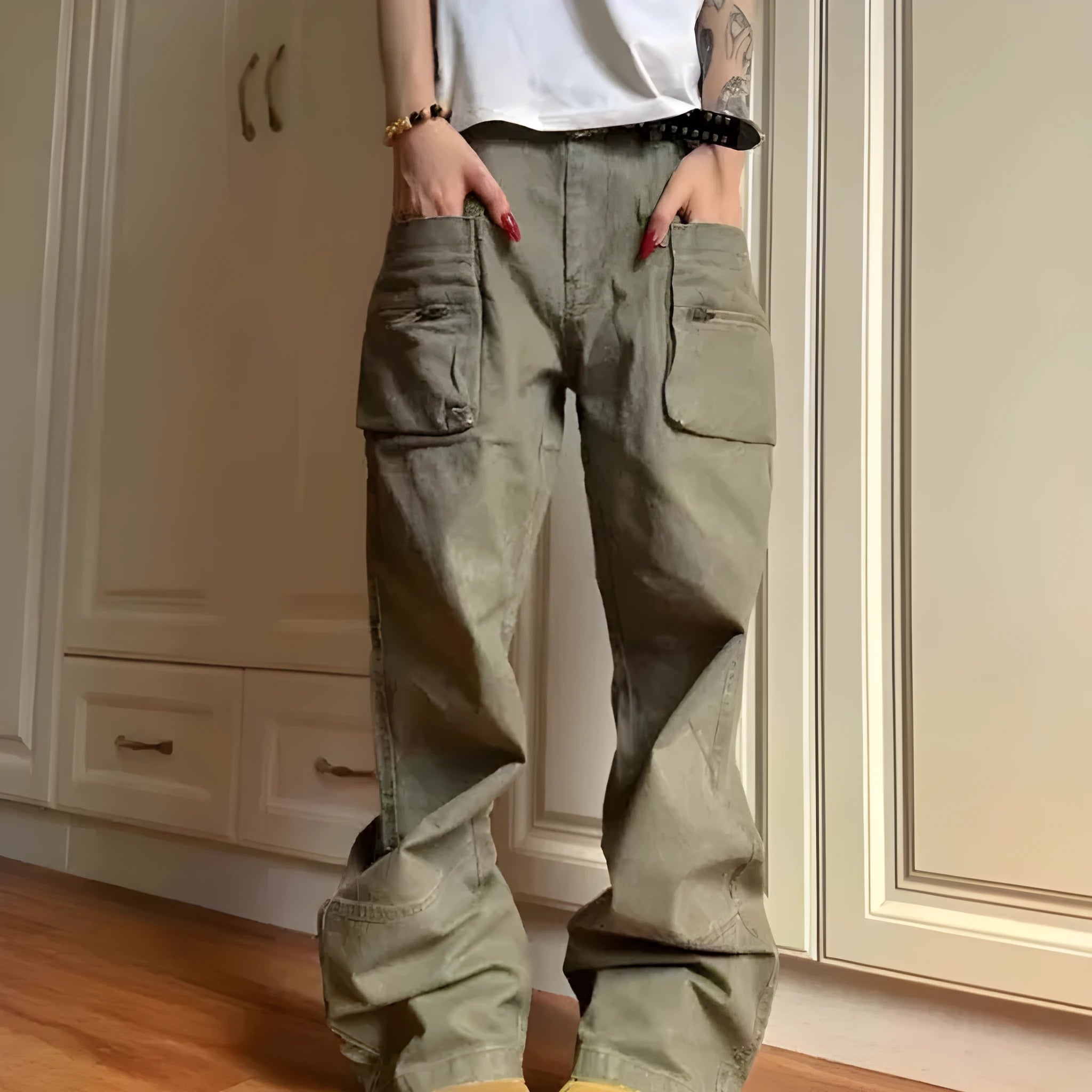 Green double zip cotton casual workwear trousers with a pocket, shown in a mid-waist fit.