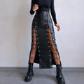 Women's black PU pencil skirt with slit and lacing detail, standing pose