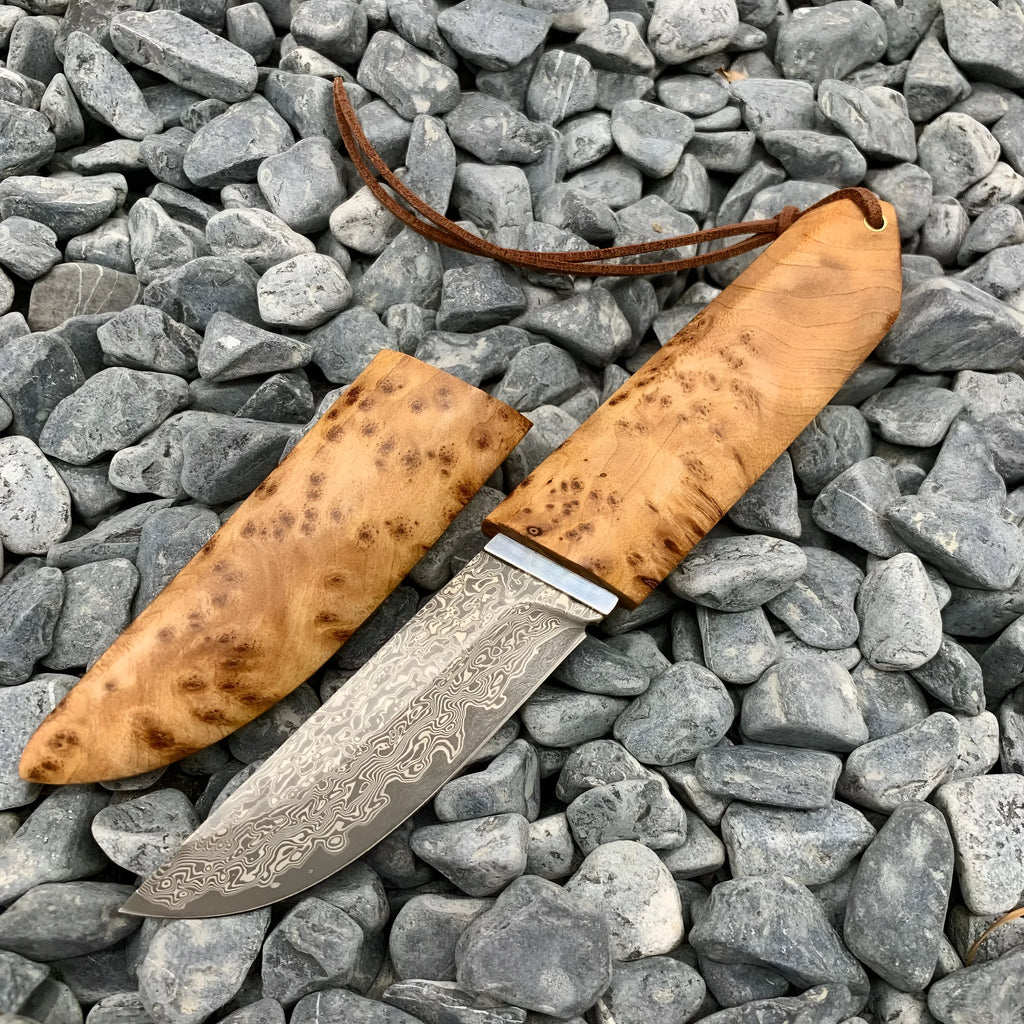 White Shadow Damascus pattern camping knife with Thuja wood handle, showing full 18cm length.