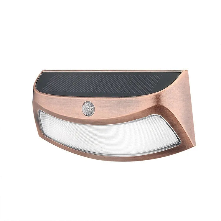 Solar outdoor wall lamp with decorative smiling face design for garden and courtyard lighting
