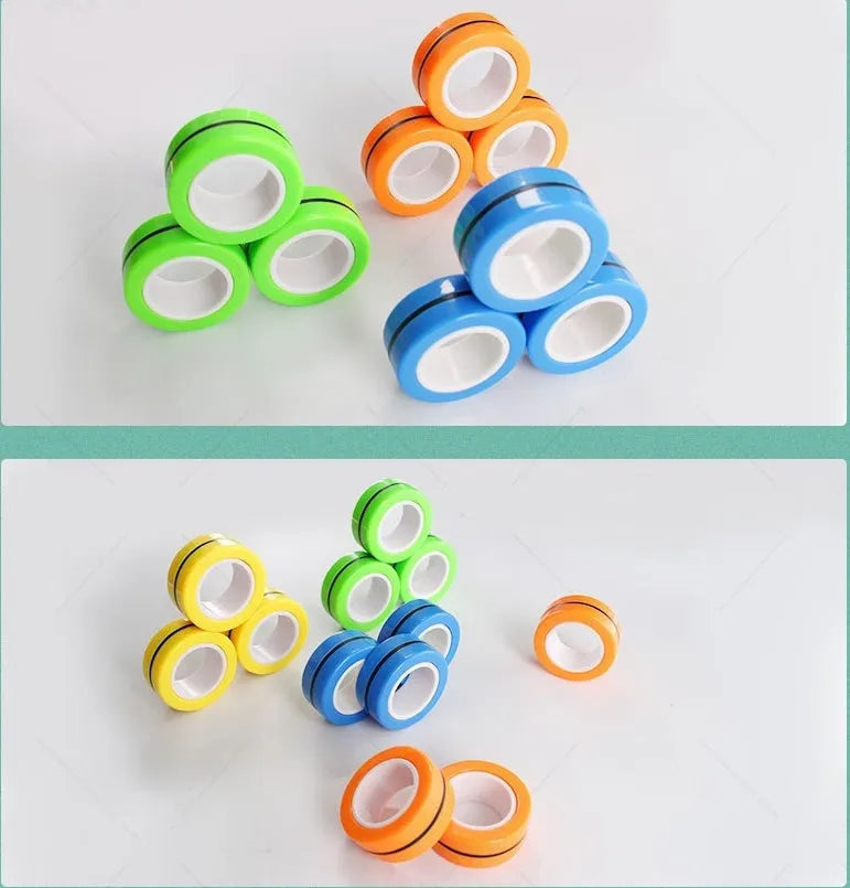 Plastic magnetic finger rotating ring spinner toy shown in multiple colours on a finger.