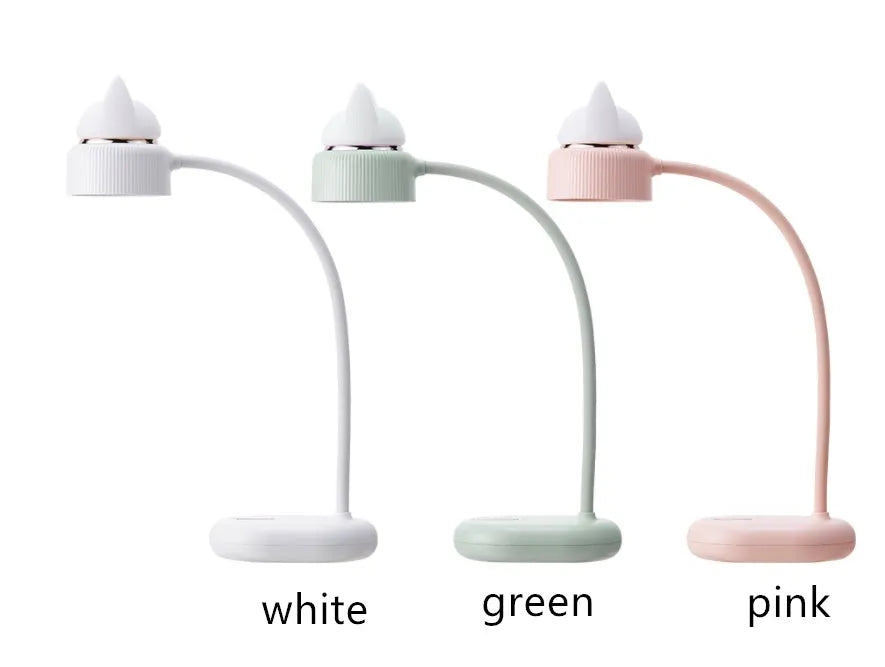White clip-on LED desk lamp with adjustable arm on desk edge