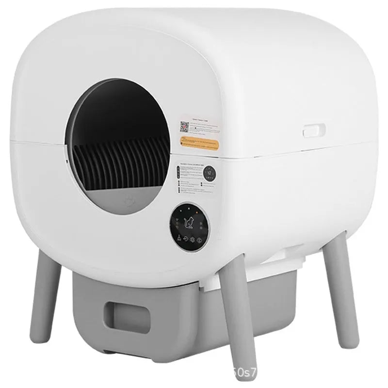 Automatic self-cleaning cat litter box made from white ABS plastic with a cleaning brush and tablets.