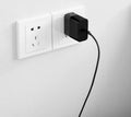 Black ZMI USB-C 65W compact notebook power adapter with folded plug.