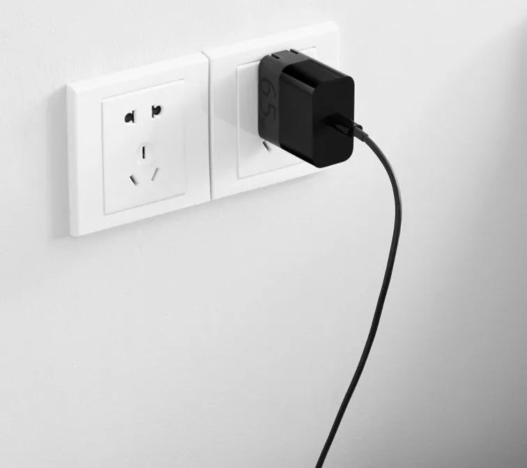 Black ZMI USB-C 65W compact notebook power adapter with folded plug.