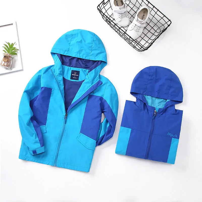 Blue lightweight boys' jacket with long sleeves and a zip, shown on a hanger.