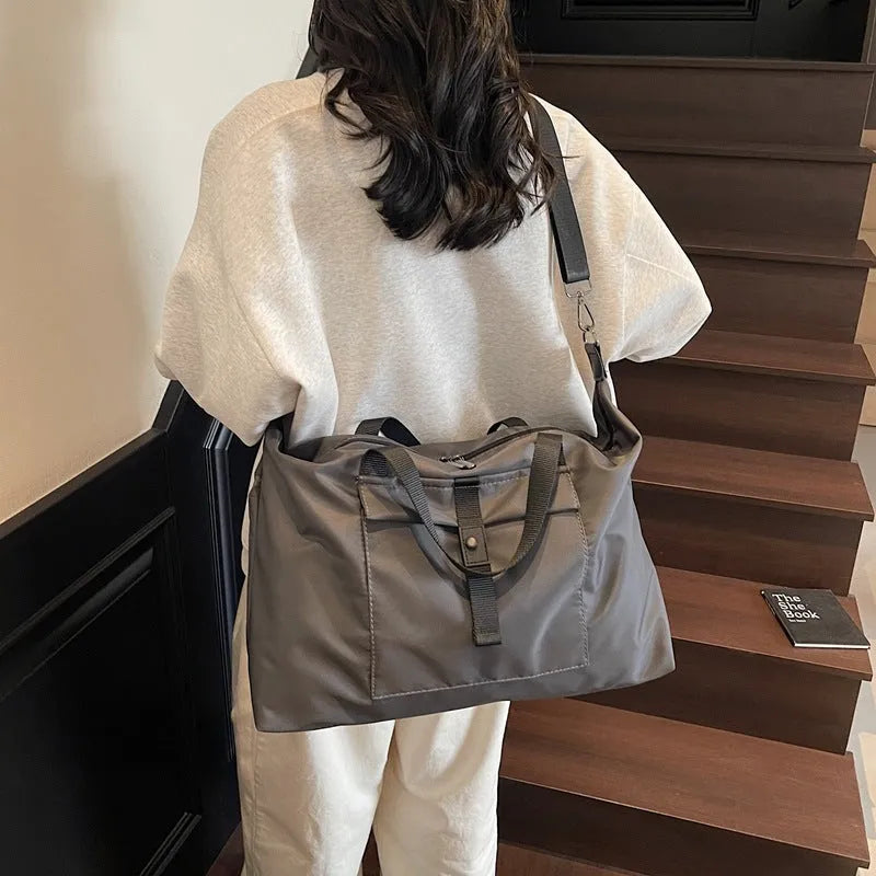 Large capacity one-shoulder travel backpack in Oxford cloth available in black, grey or green