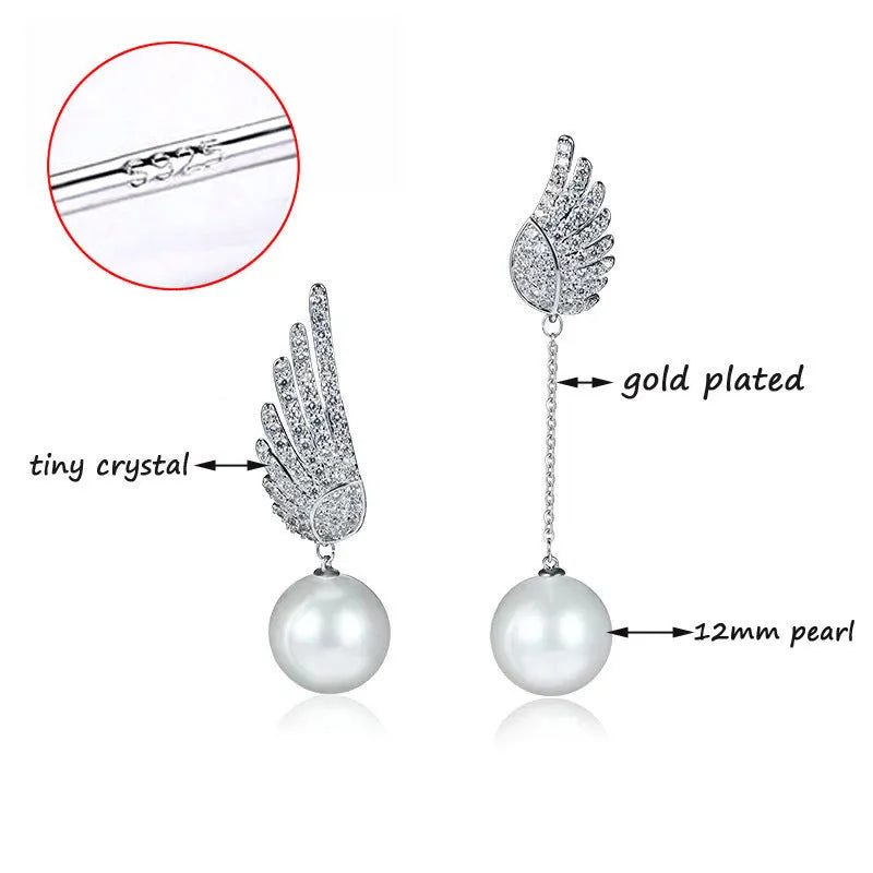 A pair of silver angel wing earrings with diamond treatment and gold-plated gemstone inlays on a platinum-colour finish.