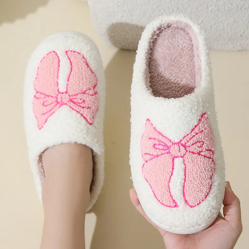 Cartoon bow knot cotton slippers in blue with suede upper and TPR sole.