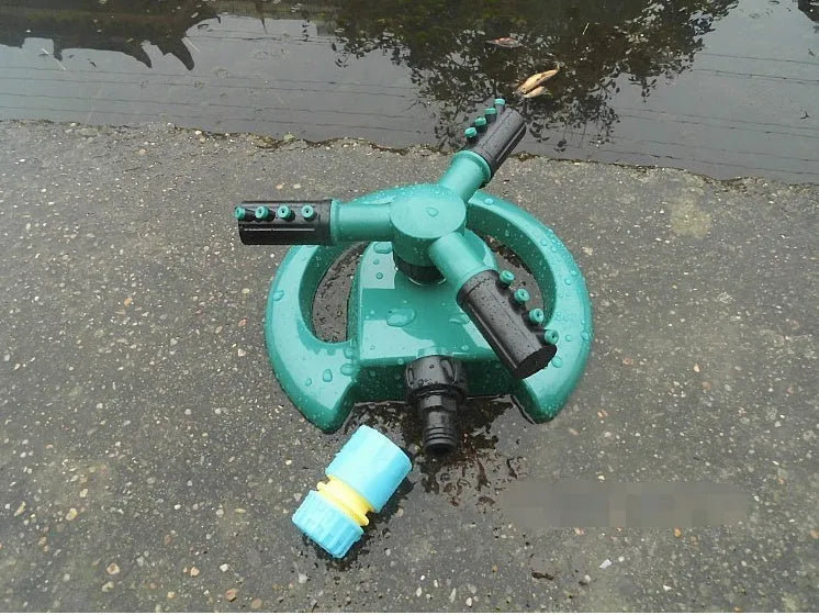 360 Rotating Sprinkler with Big 3 fork design on garden lawn, 210mm x 190mm x 95mm