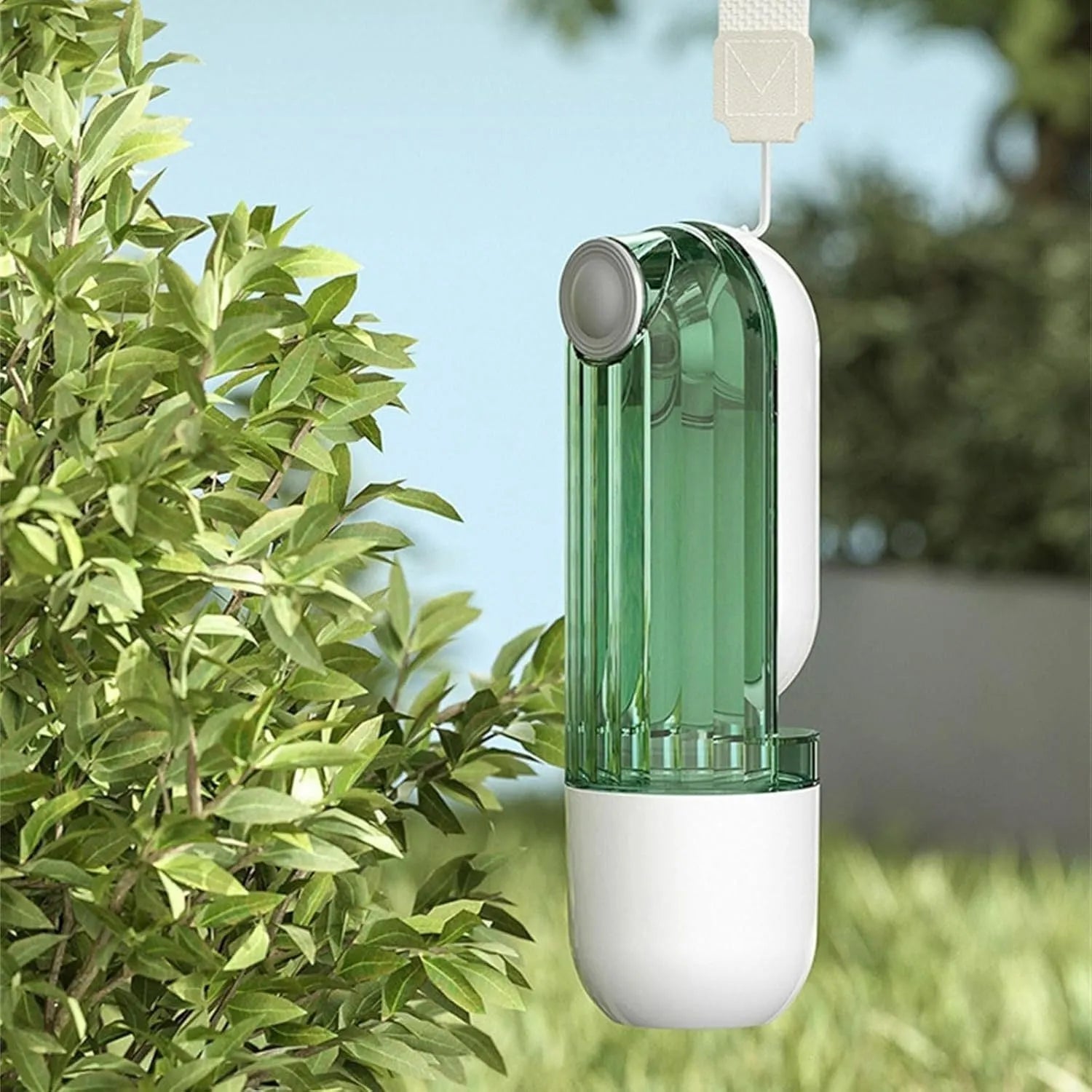 Beige and green portable dog water bottle with food dispenser, shown folded and unfolded.