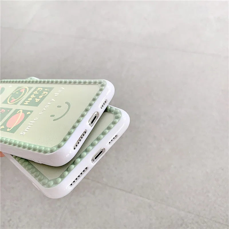 Green soft rubber TPU iPhone case with geometric pattern and smiley face polka dot frame design.