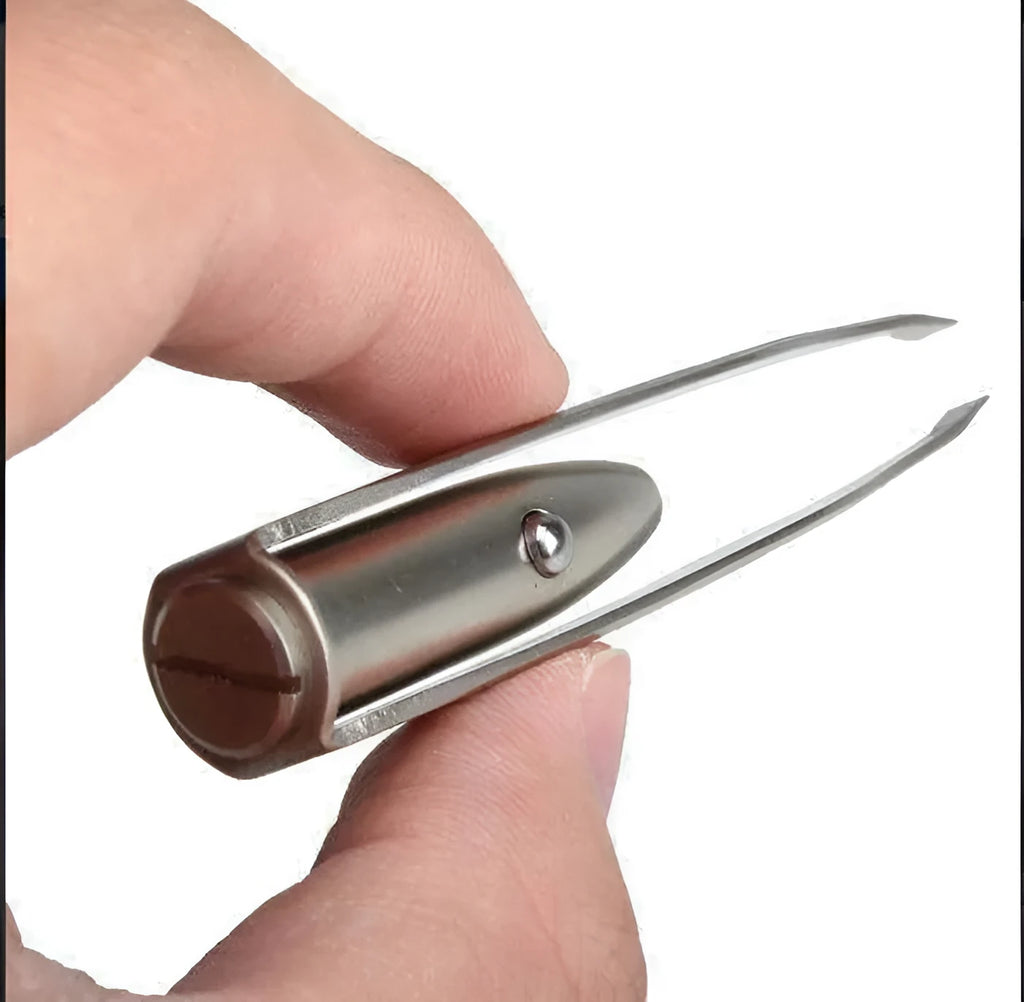 Close-up of stainless steel LED beauty tweezers with illuminated tip on a dark background