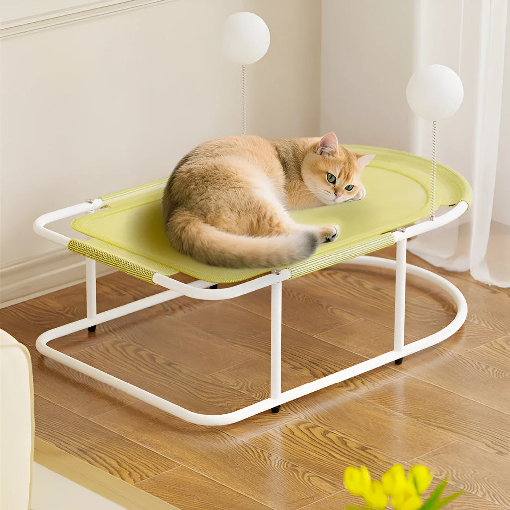 Grey fabric cat kennel with a metal bracket frame on a wooden floor.