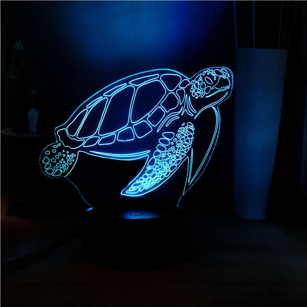 3D transparent acrylic turtle-shaped LED night light glowing with coloured light.
