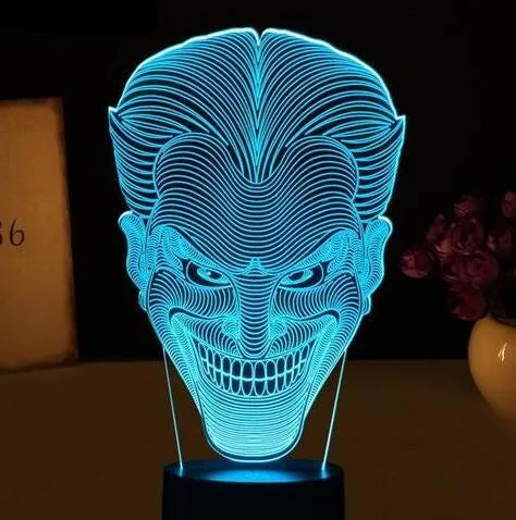 USB-powered 3D LED lamp showing multiple colours on an acrylic panel with a remote control.