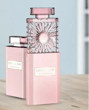 Pink portable perfume fan with USB charging port and integrated rechargeable battery