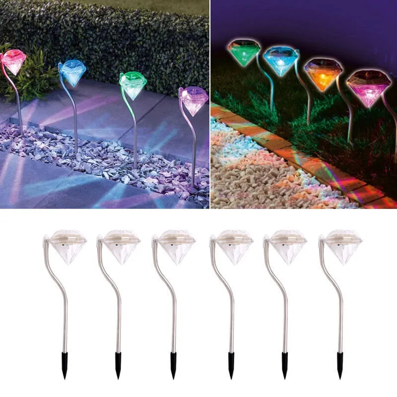 White solar-powered diamond-shaped garden light with adjustable angle and solar panel on top.