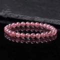 Women's fashion bracelet with polished strawberry quartz crystal beads.