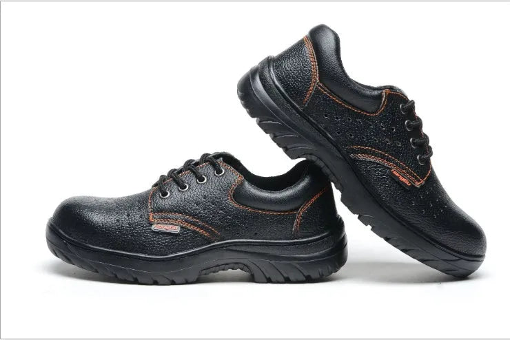 Black antiskid safety work shoes with steel toe, embossed cowhide upper, on a white background