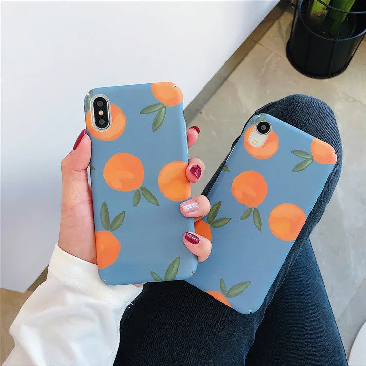 Orange and blue retro design plastic back cover case for iPhone on a table.