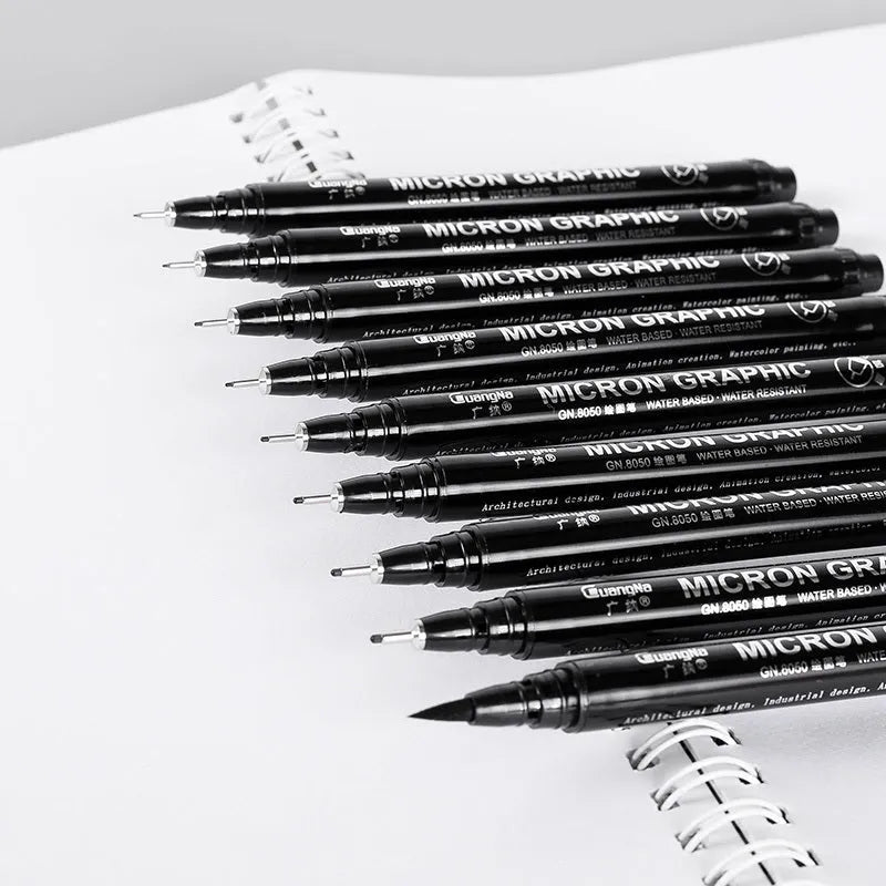 Set of 12 black comic art pens with 9 microtip nib sizes in storage organiser for detailed drawing
