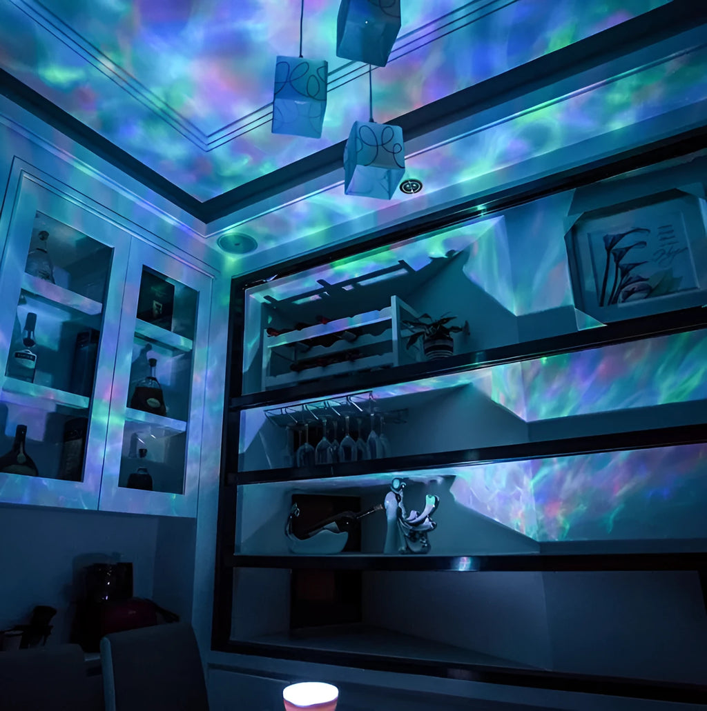Ocean wave projector showing multicolour LED light display on a dark ceiling