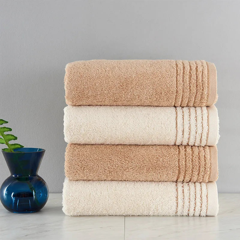 Cotton towel set showing beige and brown options with 34cm and 70cm sizes