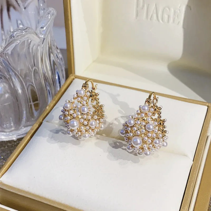 Gold-colour copper flower basket earrings with small beads and pearl inlay decoration