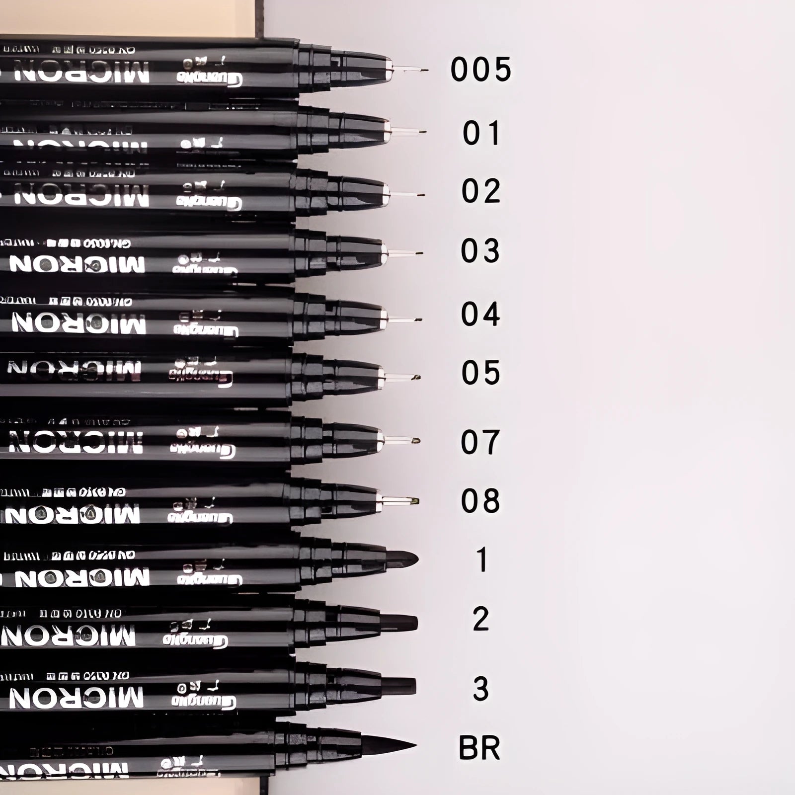 Set of 12 black comic art pens with 9 microtip nib sizes in storage organiser for detailed drawing