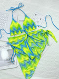 Green tie-dyed women's bikini set with sleeveless top, briefs, and a matching outer skirt.