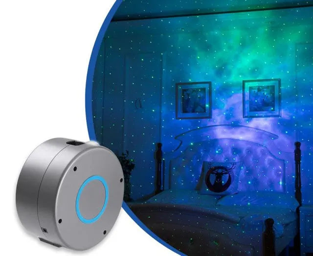 Grey starry sky projection lamp with remote control on a table, projecting light onto a ceiling.