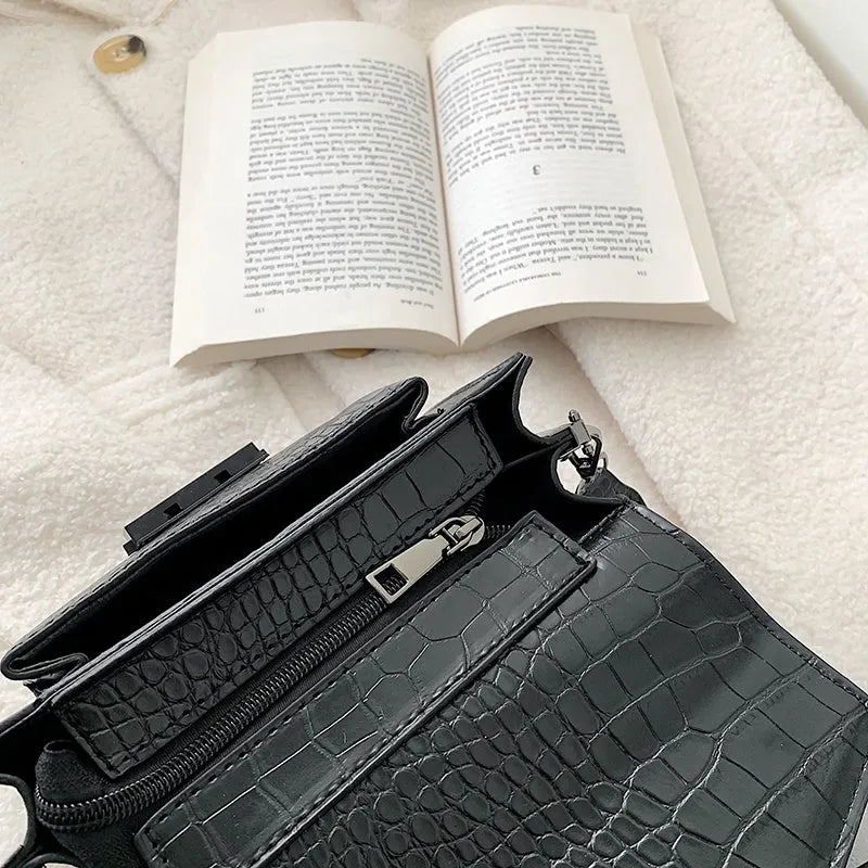 Vintage PU leather crossbody bag in black, shown with dimensions 20cm wide by 14cm high