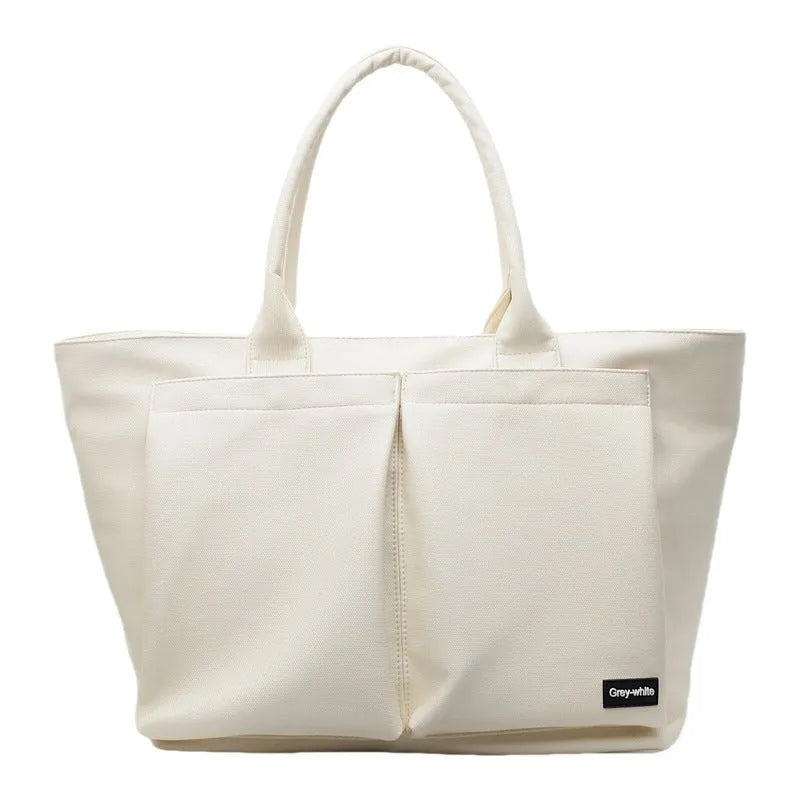Lightweight PU shoulder bag in solid colour with ventilation features and 20-35L capacity