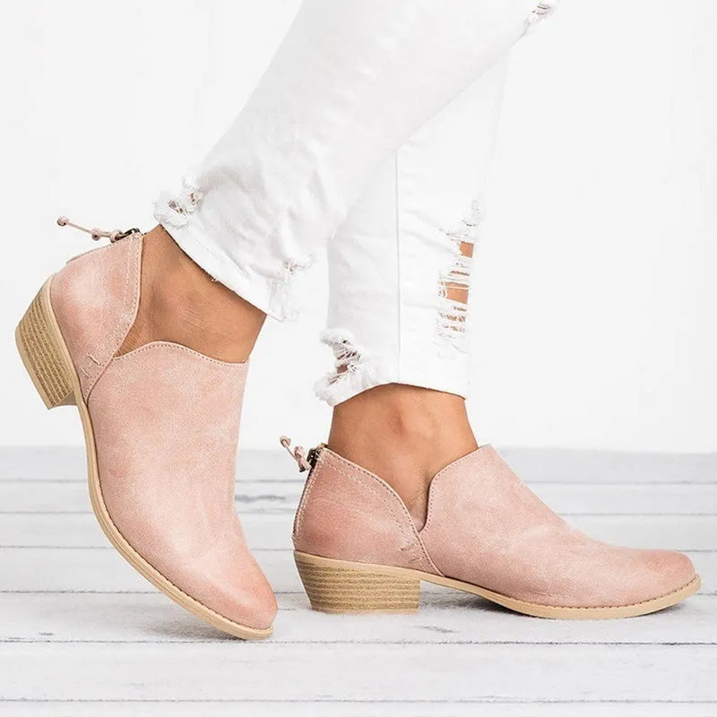 Women's butterfly-knot slip-on ankle boots in faux suede with square heel and pointed toe, available in Beige, Black, and Pink