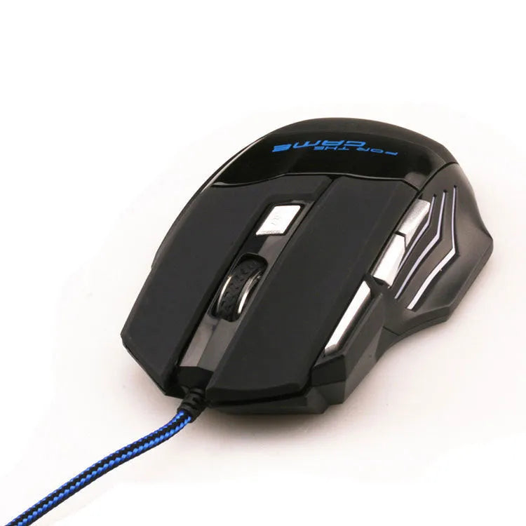 Black wired USB gaming mouse with colourful LED lights and Tyrannosaurus Rex graphic on a desk