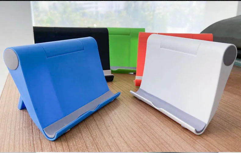 Folding mobile phone tablet stand in multiple colours showing adjustable angle mechanism