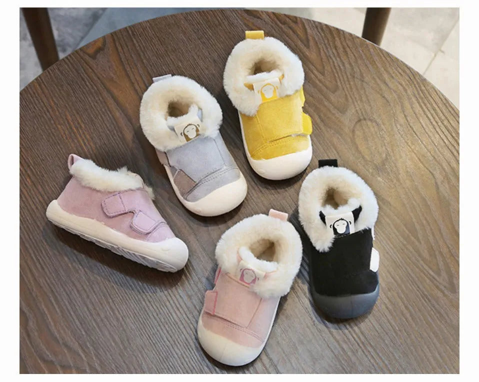 Children's velvet toddler shoes in various colours, showing non-slip sole and soft upper.