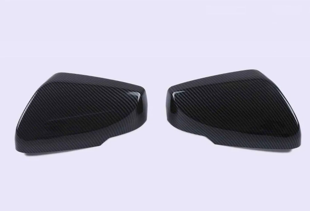 Pair of ABS plastic rearview mirror covers for Cadillac CT5 CT6 in carbon fibre, silver, and rain frame finish options.