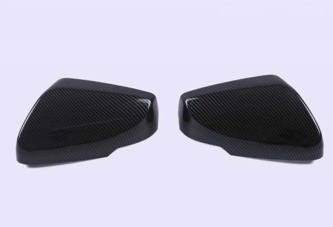 Pair of ABS plastic rearview mirror covers for Cadillac CT5 CT6 in carbon fibre, silver, and rain frame finish options.